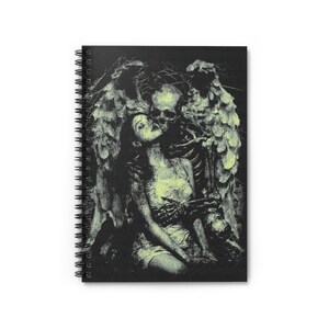 May include: Spiral-bound notebook featuring a black and white illustration of a skeleton embracing a woman with angel wings. The artwork has a vintage, gothic aesthetic with a neon green tint. The notebook's design is suitable for note-taking or sketching.