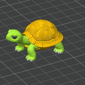 May include: A 3D-rendered turtle figurine. The turtle has a bright yellow shell with a textured pattern and a green body, including the head, legs, and feet. The background is a gray grid.