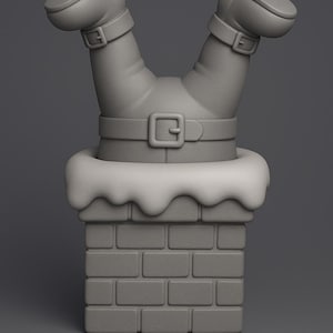 May include: A monochromatic gray figurine depicting a pair of legs wearing boots and a belt, positioned upside down as if diving into a brick chimney topped with a layer of snow. The sculpture features a smooth, matte finish throughout the entire piece.