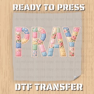 May include: A ready-to-press DTF transfer featuring the word "PRAY" in a patchwork design. The letters are composed of various pastel-colored fabric squares, some with floral patterns. The design is on a light gray background.