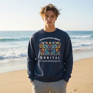 Bluza unisex z nadrukiem astronauty „Space Station Gossip”, z okrągłym dekoltem z organicznej dzianiny frotte, z nadrukiem DTG z przodu.