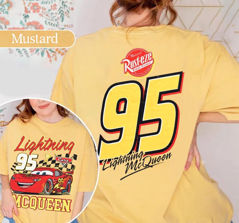 May include: Mustard-coloured t-shirt featuring Lightning McQueen from the Cars film. The front graphic shows the race car with the number 95, while the back displays a large yellow 95 and the Rust-eze logo.