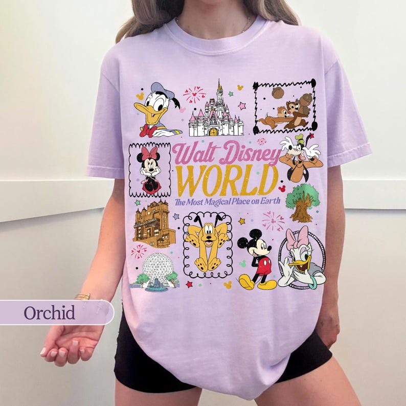 May include: Orchid-colored t-shirt featuring a collage of Disney characters and landmarks. The shirt includes Donald Duck, Minnie Mouse, Mickey Mouse, and Daisy Duck, along with the text "Walt Disney World: The Most Magical Place on Earth."