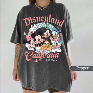 May include: A handmade wooden sign with the text "Welcome to our home" in a handwritten style. The sign is painted white with black lettering and a distressed finish, perfect for home decor.