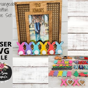 May include: A wooden frame set with interchangeable rattan panels. The frame has a photo of a couple in front of a bridge. The frame is decorated with five colorful bunny figures. The text "The Taylors" is on the frame. The image also shows a variety of other wooden cutouts, including pumpkins, a snowman, a Christmas tree, a truck, and a heart.