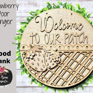 May include: Wooden door hanger with a welcome to our patch sign, a basket design, and two strawberries. The sign is unfinished and ready to be painted.