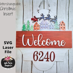 May include: A wooden Christmas-themed welcome sign with a red and white color scheme. The sign features a decorative top with a sleigh and reindeer, houses, and trees. The word "Welcome" and the number "6240" are prominently displayed.