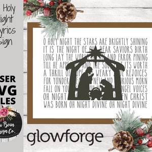 May include: A white sign with brown trim features the lyrics to the Christmas carol "O Holy Night". The lyrics are printed in black text. A silhouette of the nativity scene is included in the design. The sign is labeled "O Holy Night Lyrics Sign" and "Laser SVG Files".
