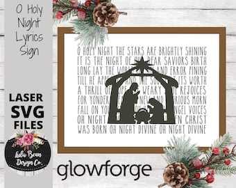 May include: A white sign with brown trim features the lyrics to the Christmas carol "O Holy Night". The lyrics are printed in black text. A silhouette of the nativity scene is included in the design. The sign is labeled "O Holy Night Lyrics Sign" and "Laser SVG Files".