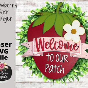 May include: A red and green strawberry-shaped door hanger with a white flower and the text "Welcome to our Patch".