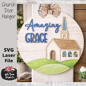 May include: A round wooden church door hanger with the words "Amazing Grace" in blue script. The design includes a church illustration, a green hill, and a beige bow. The words "Church Door Hanger" and "SVG Laser File" are also visible.