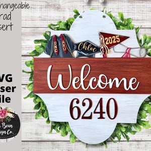 May include: A white and red welcome sign with a green leafy wreath around it. The sign has a brown wooden panel with the word "Welcome" in white script. The top panel has a white background with the number "6240" in red. There are two graduation caps and a red and white banner with the year "2025" on it.