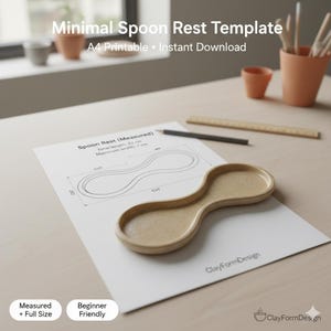May include: A beige ceramic spoon rest with a curved design, placed on a white paper with a template. The paper includes measurements and the text "Spoon Rest (Measured)". The image also shows a pencil, ruler, and small terracotta pots.