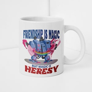 May include: White ceramic mug with a cartoon illustration of a pink pony-like creature in a blue robot suit. The text "FRIENDSHIP IS MAGIC" and "BUT MAGIC IS HERESY" are printed on the mug.