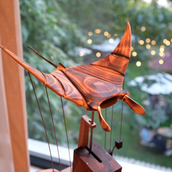 588 favorites don't lie — this hand-crafted flying manta ray automaton is a jaw-dropping kinetic desk sculpture that moves like it's swimming through air.