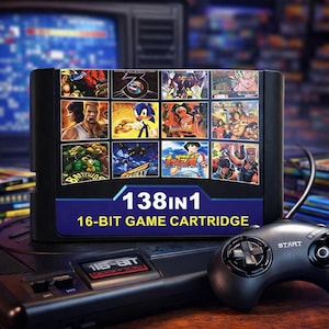 May include: A black 16-bit game cartridge featuring multiple game covers, including Sonic the Hedgehog. The cartridge is labelled "138 in 1" and "16-BIT GAME CARTRIDGE". A black game console and controller are visible.