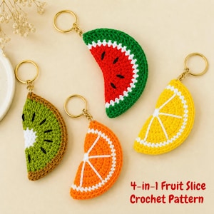 May include: Four crochet fruit slice keychains: a watermelon, kiwi, orange, and lemon. Each keychain has a gold-colored ring. The watermelon is red, green, and white. The kiwi is green, brown, and white. The orange is orange and white. The lemon is yellow and white. The text reads "4-in-1 Fruit Slice Crochet Pattern."