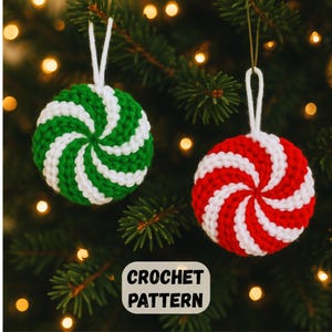May include: Two crochet Christmas ornaments in the shape of peppermint candies. One is green and white, the other is red and white. The ornaments are hanging on a Christmas tree. The text "CROCHET PATTERN" is in a white box.