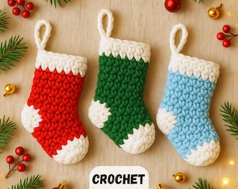 May include: Three miniature crochet Christmas stockings in red, green, and blue with white detailing. The stockings are arranged on a neutral surface with festive decorations, including greenery, berries, and baubles. The text "CROCHET PATTERN" is visible.