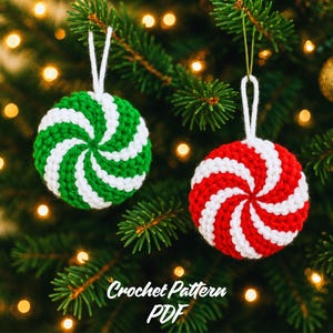 May include: Two round crochet ornaments featuring a spiral peppermint candy design. One ornament is green and white, and the other is red and white. Each piece has a white yarn loop for hanging. The text Crochet Pattern PDF is visible.