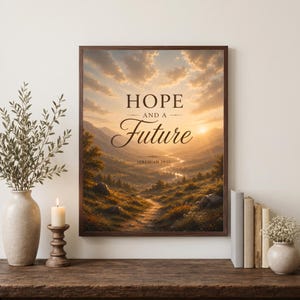 May include: A framed wall art print featuring a landscape of a valley at sunset with the text HOPE AND A Future JEREMIAH 29:11. The image shows a winding path through trees and mountains under a golden sky with clouds, displayed in a dark wood frame.