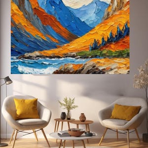 May include: An abstract oil painting of a mountain landscape with bold colours. The artwork shows blue mountains, orange and yellow hills, and a blue river. The painting is displayed above two chairs with yellow cushions, creating a cosy living room setting.