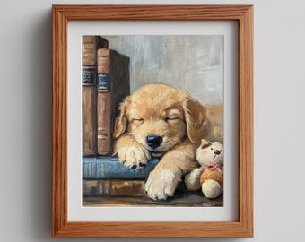 Könnte beinhalten: Ein gerahmter Ölgemäldedruck mit dem Titel Annaive Studio Prints zeigt einen goldenen Welpen, der mit dem Kopf auf einem Stapel brauner und blauer Bücher schläft, neben einem kleinen beigen Teddybären mit rosa Schleife. Der Rahmen ist aus hellem Holz.
