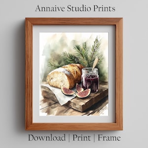 Op de afbeelding: Ingelijste aquarelprint met een brood, een pot jam en gesneden vijgen. De print bevat de tekst "Annaive Studio Prints" bovenaan en "Download | Print | Frame" onderaan.