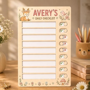 May include: A rectangular wooden daily checklist board featuring the text AVERY'S DAILY CHECKLIST. The board includes a cartoon deer, a bird, and floral illustrations. It has eight blank rows for writing and sliding toggles with green checkmarks.