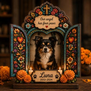 May include: A wooden memorial shrine featuring a portrait of a black and tan long-haired dog. The frame is decorated with colorful floral carvings, hearts, and a cross. It includes the text Our angel has four paws and Luna 2013-2024.