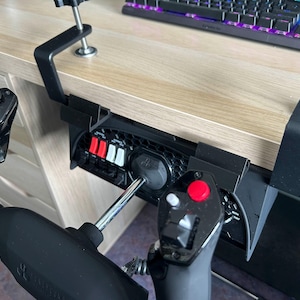 May include: A set of three ceramic mugs with a speckled, matte finish. The mugs are in shades of cream, light gray, and dark gray. Each mug has a simple, minimalist design and a rounded handle. Perfect for coffee or tea.