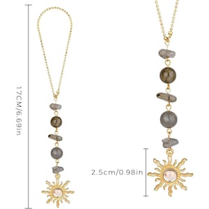 May include: A gold-toned beaded chain ornament featuring alternating grey stone beads and a sun-shaped pendant with a central stone. The total length is 6.69 inches, and the sun pendant measures 0.98 inches in diameter, as indicated by labels.