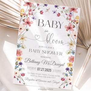 May include: Baby shower invitation with floral accents. The invitation reads "BABY in bloom" and includes details for Bethany McDougal's baby shower on July 27, 2025. The design features pink, yellow, and purple flowers.