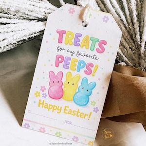 May include: A white gift tag with the text "TREATS for my favorite PEEPS!" in colorful letters. Below are three bunny-shaped marshmallow treats in pink, yellow, and blue. The tag also says "Happy Easter!"