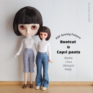 May include: Two dolls with dark brown bob haircuts wearing white long-sleeve mock neck shirts. One doll wears blue denim bootcut pants, the other wears patterned capri pants. Text reads: PDF Sewing Pattern Bootcut & Capri pants Blythe Licca Obitsu22 PNXS.