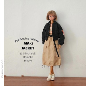 May include: A doll wearing a black MA-1 jacket, a beige skirt with cargo pockets, and white sneakers. Text reads: PDF Sewing Pattern MA-1 JACKET 11.5 inch doll Momoko Blythe. The doll has short brown hair and is dressed in a casual, layered outfit.
