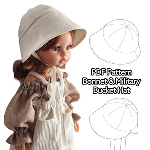 May include: A doll wearing a beige corduroy bonnet and a brown dress with white overalls. The image includes a line drawing of a bonnet and bucket hat, with the text "PDF Pattern Bonnet & Military Bucket Hat."