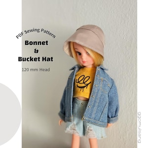 May include: A doll wearing a beige bucket hat, a yellow crop top with a black graphic, and a blue denim jacket over light blue distressed denim shorts. Text reads: PDF Sewing Pattern Bonnet & Bucket Hat 120 mm Head.