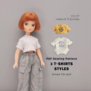 May include: A doll with short ginger hair wearing a white t-shirt and grey pinstriped cargo pants. Beside the doll are two small t-shirts, one mustard yellow with a black graphic and one white with a blue graphic. Text reads: PDF Sewing Pattern 3 T-SHIRTS STYLES Small 1/6 doll.