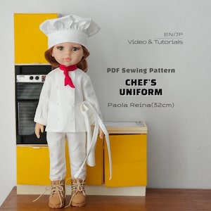 May include: A doll wearing a white chef's uniform, including a toque, jacket, and pants, with a red neckerchief and tan lace-up boots. Text reads: EN/JP Video & Tutorials, PDF Sewing Pattern, CHEF'S UNIFORM, Paola Reina(32cm).