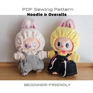 May include: Two plush rabbit dolls wearing hoodies and overalls. The left doll wears a floral print hoodie and gray overalls. The right doll wears a yellow hoodie and dark denim overalls. Text reads: PDF Sewing Pattern Hoodie & Overalls BEGINNER-FRIENDLY.