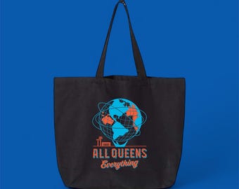 May include: Black tote bag with a graphic of a globe in blue and orange, encircled by blue lines. The text "ALL QUEENS Everything" is below the globe in orange and blue. The bag has two black handles.