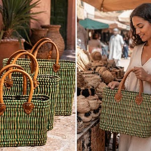 May include: Woven green and tan tote bags with brown leather handles. The bags have a rectangular shape and are displayed in a group of three. One bag is held by a person in a market setting.