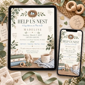 May include: A digital baby shower invitation displayed on a tablet and smartphone screen, featuring a bird's nest with blue eggs, eucalyptus branches, a stack of folded baby clothes, a plush bunny, and a ceramic mug on a wooden surface.
