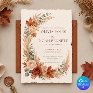 May include: A rectangular wedding invitation with deckled edges featuring a floral wreath of rust-colored maple leaves, pampas grass, and roses. The text reads: Together with their families Olivia James & Noah Bennett are getting married October 3, 2026.