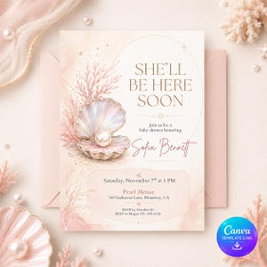 May include: A rectangular baby shower invitation card featuring a watercolor illustration of an open seashell with a pearl inside, surrounded by coral branches. The text reads: SHE'LL BE HERE SOON, Sofia Bennett, Saturday, November 7th at 1 PM.