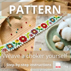 May include: A beaded choker strip featuring a repeating floral pattern in red, yellow, blue, purple, and green on a white background. The strip is displayed alongside loose beads, cotton bolls, and a small green dish on a wooden surface.