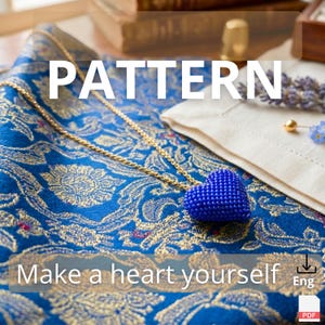 May include: A blue beaded heart pendant necklace with a gold chain rests on a patterned blue fabric. The word "PATTERN" is displayed in large white letters. The text "Make a heart yourself" is also visible.