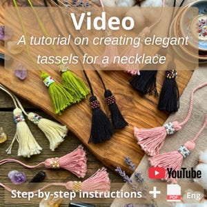 May include: A variety of handmade necklace tassels in shades of green, black, pink, and cream, displayed on a wooden board. The tassels are adorned with beads and are part of a tutorial on creating elegant tassels. The image includes text that says "Video" and "Step-by-step instructions".