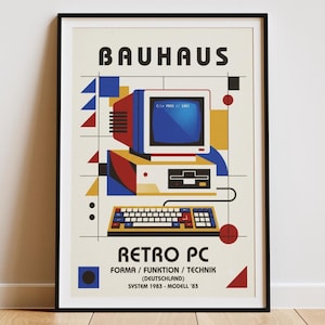 May include: A framed poster featuring a retro computer illustration in a geometric style. The text reads BAUHAUS, RETRO PC, FORMA / FUNKTION / TECHNIK (DEUTSCHLAND), SYSTEM 1983 - MODELL '83. The design uses blue, red, yellow, and black shapes.